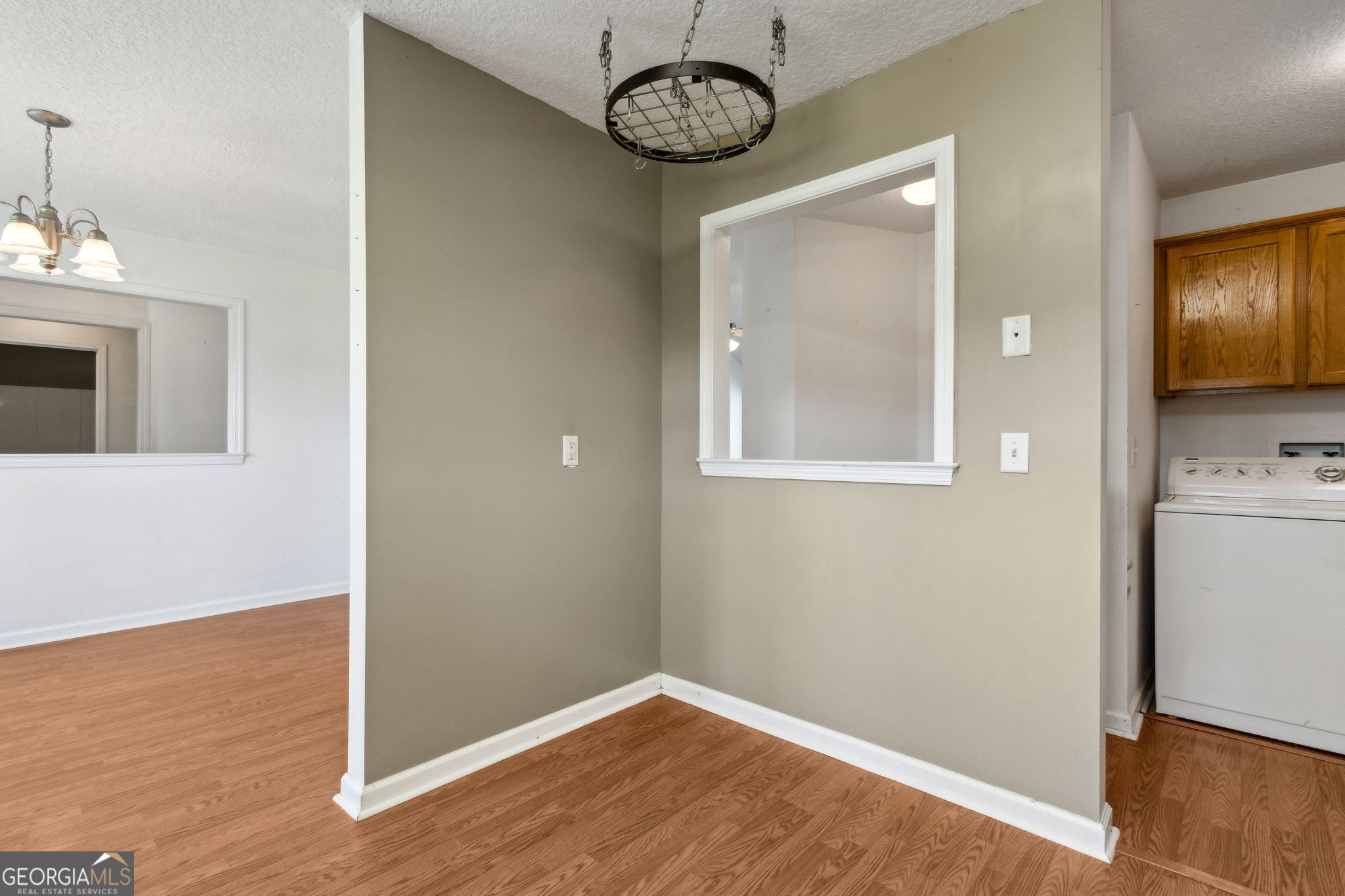 77 Thoroughbred Road Woodbine, GA 31569 - Photo 32 of 73 a view of a hallway with wooden floor and a bathroom