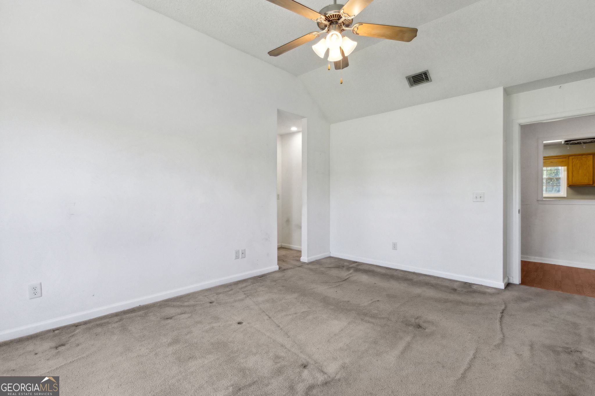 77 Thoroughbred Road Woodbine, GA 31569 - Photo 34 of 73 an empty room with a chandelier fan and windows