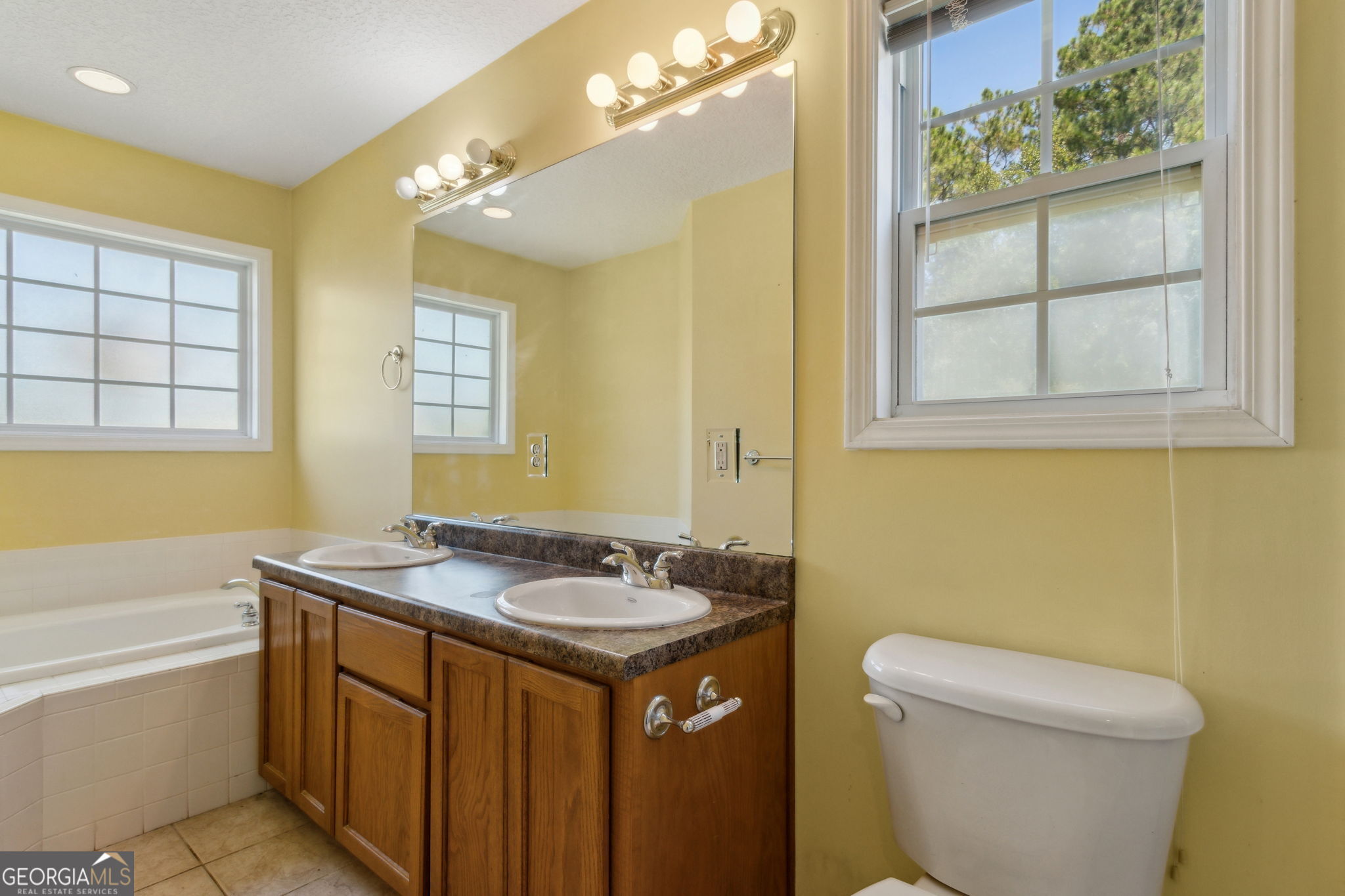 77 Thoroughbred Road Woodbine, GA 31569 - Photo 40 of 73 a bathroom with a granite countertop sink toilet and shower