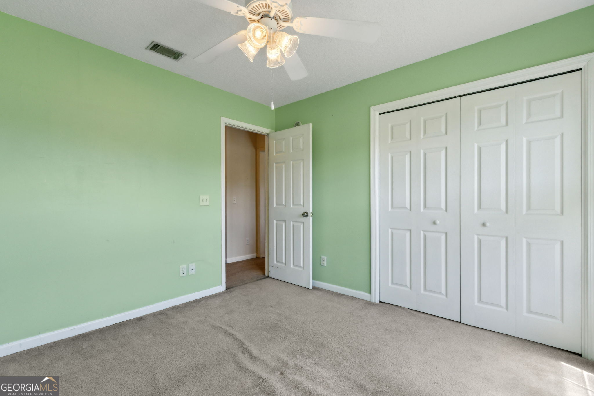 77 Thoroughbred Road Woodbine, GA 31569 - Photo 42 of 73 an empty room with a chandelier fan