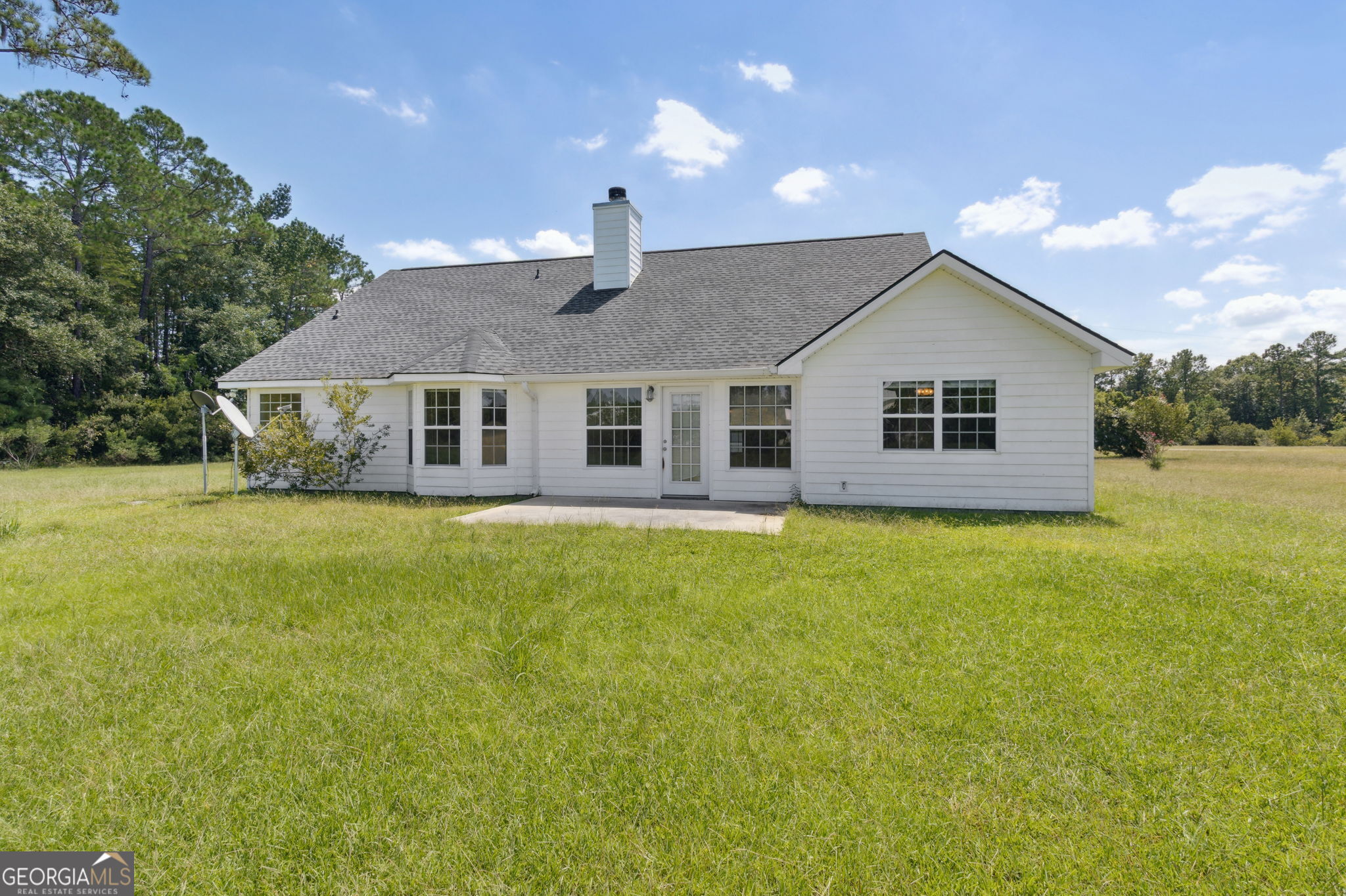 77 Thoroughbred Road Woodbine, GA 31569 - Photo 49 of 73 a view of a house with a backyard