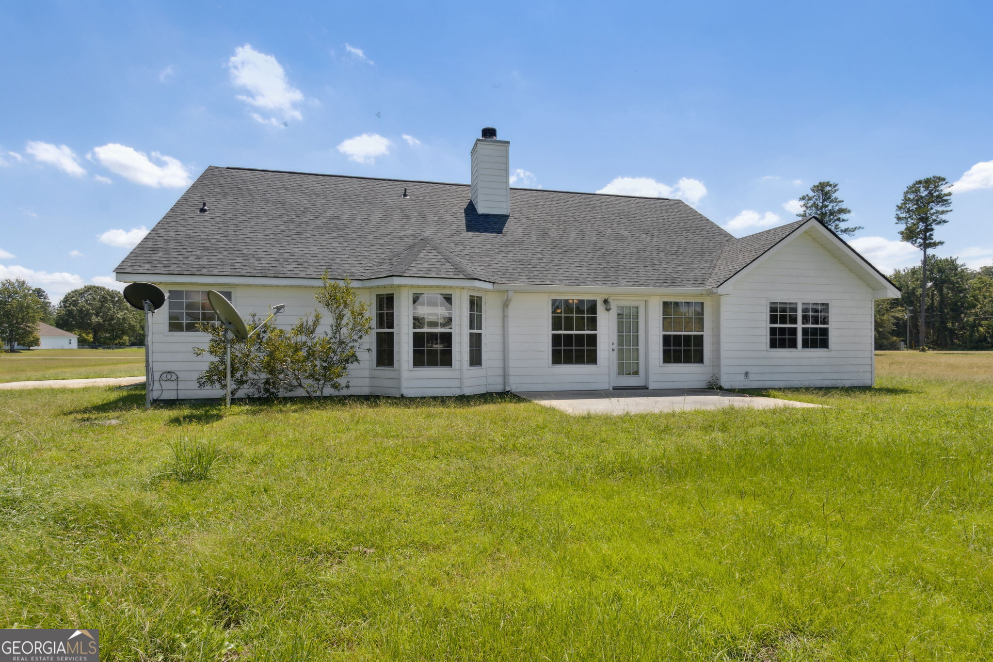77 Thoroughbred Road Woodbine, GA 31569 - Photo 54 of 73 a front view of a house with a yard