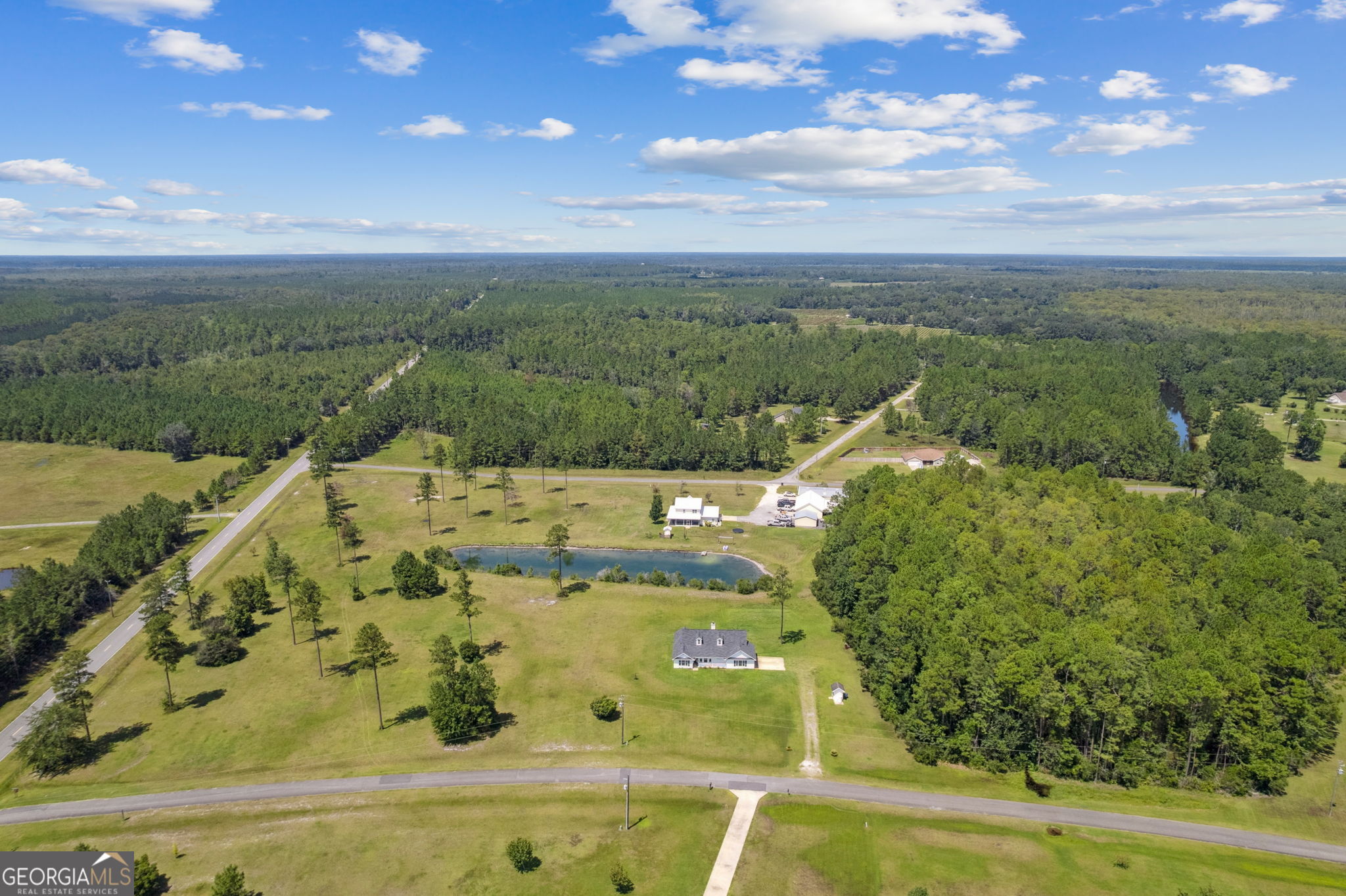 77 Thoroughbred Road Woodbine, GA 31569 - Photo 61 of 73 a view of a swimming pool with a yard