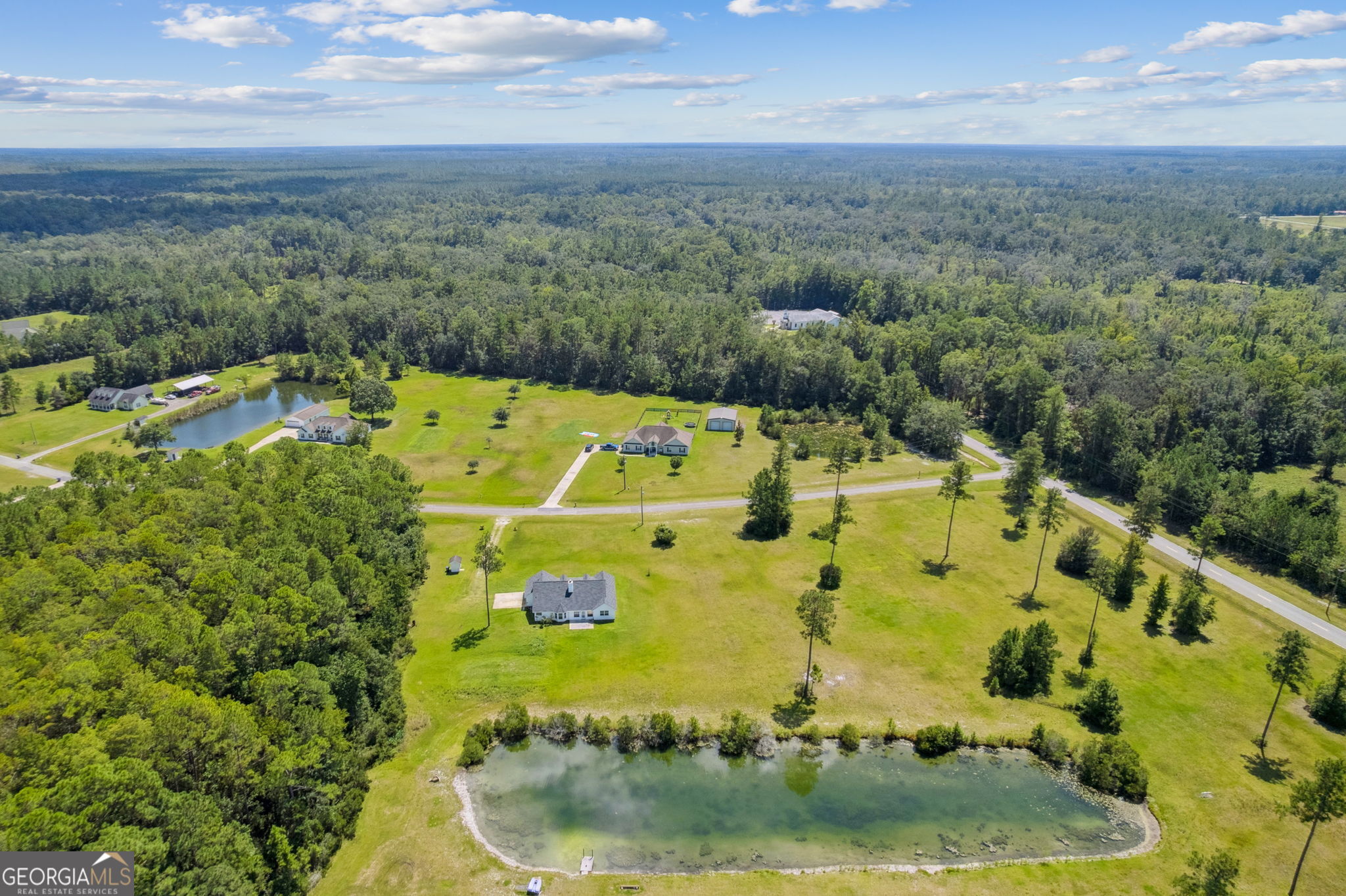 77 Thoroughbred Road Woodbine, GA 31569 - Photo 67 of 73 a view of a swimming pool with a yard