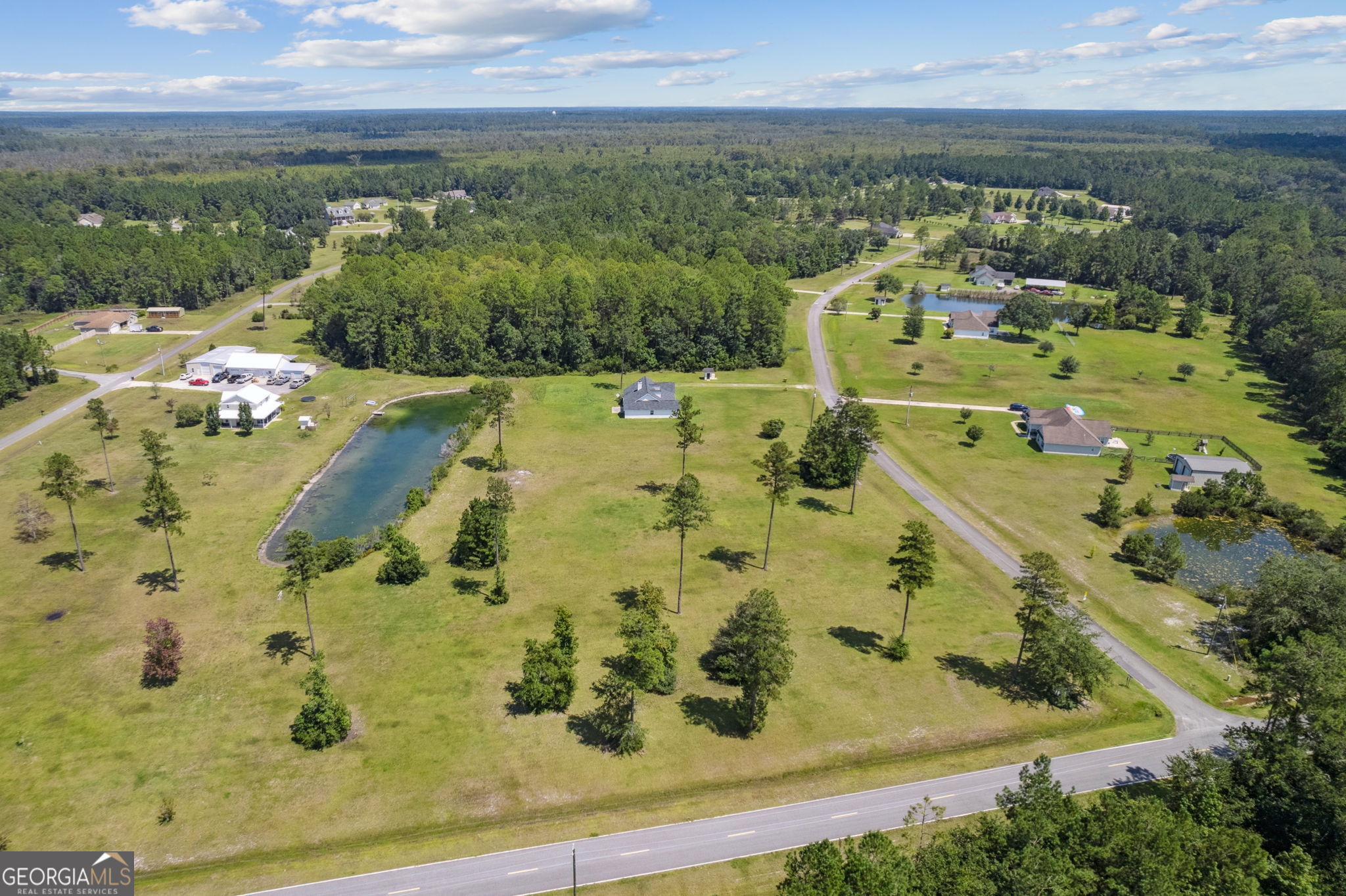 77 Thoroughbred Road Woodbine, GA 31569 - Photo 71 of 73 an aerial view of residential houses with outdoor space