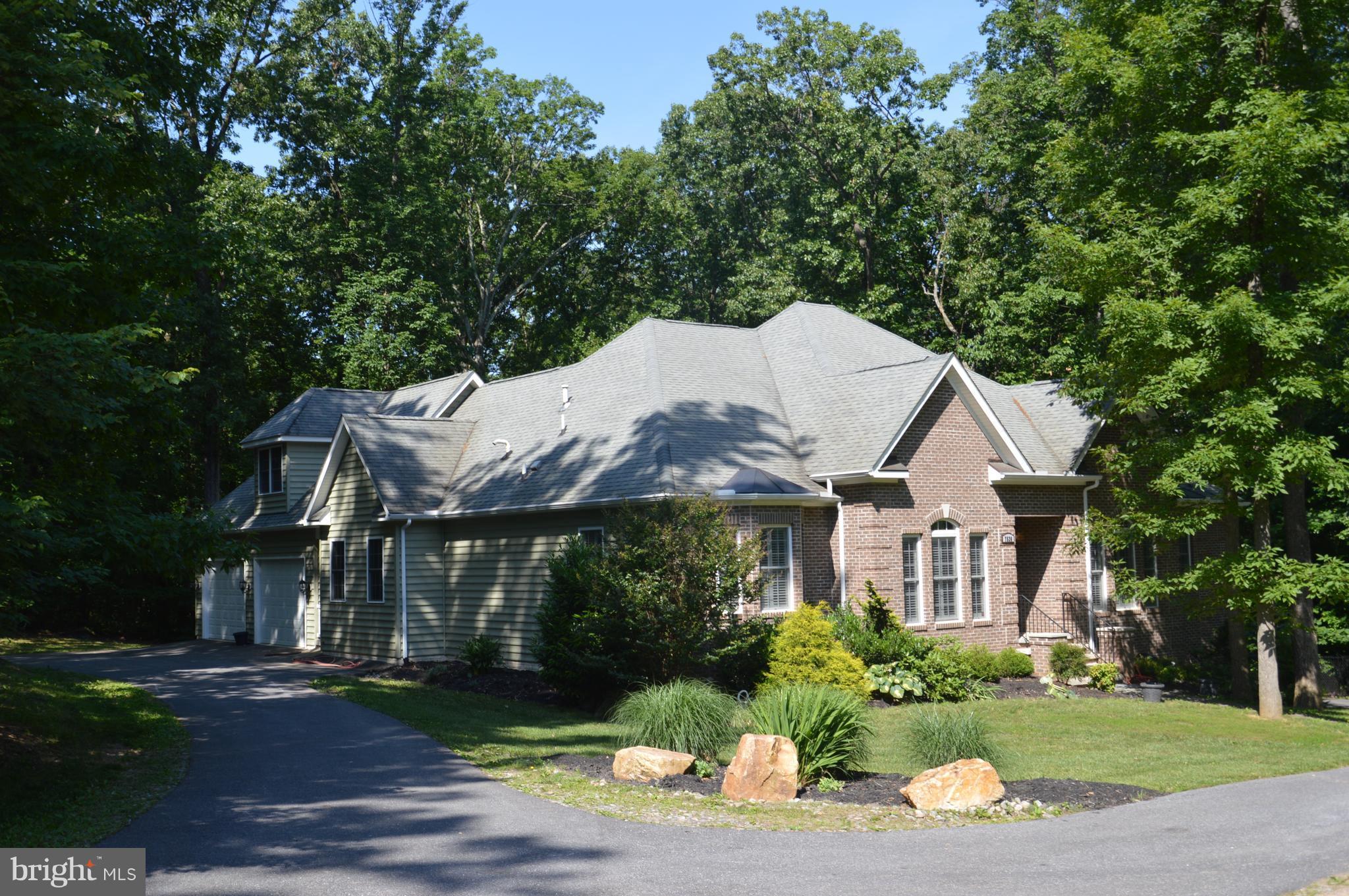 7536 Talbot Run Road Mount Airy, MD 21771 - Photo 1 of 22 a front view of a house with a yard and green space