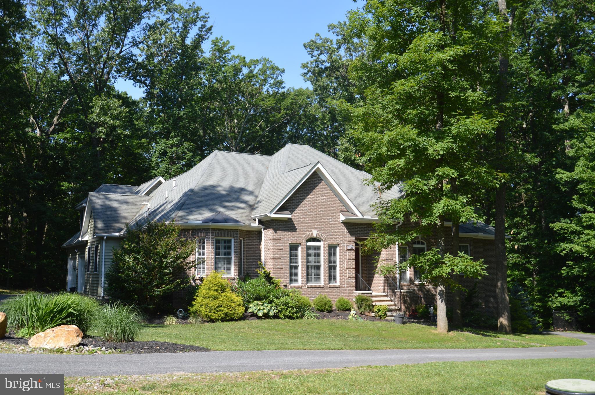 7536 Talbot Run Road Mount Airy, MD 21771 - Photo 2 of 22 a front view of a house with a garden