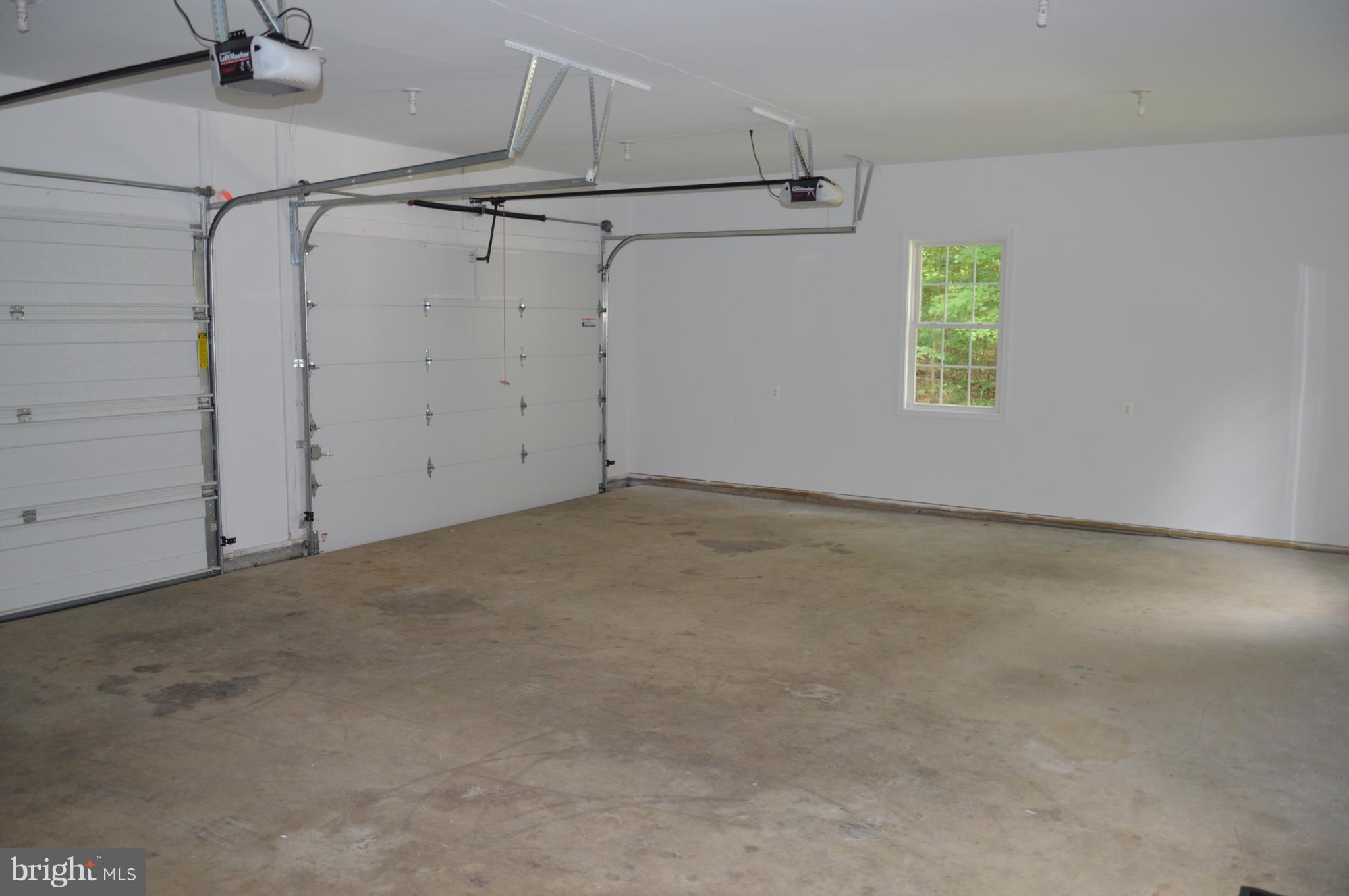 7536 Talbot Run Road Mount Airy, MD 21771 - Photo 15 of 22 an empty room with windows and refrigerator