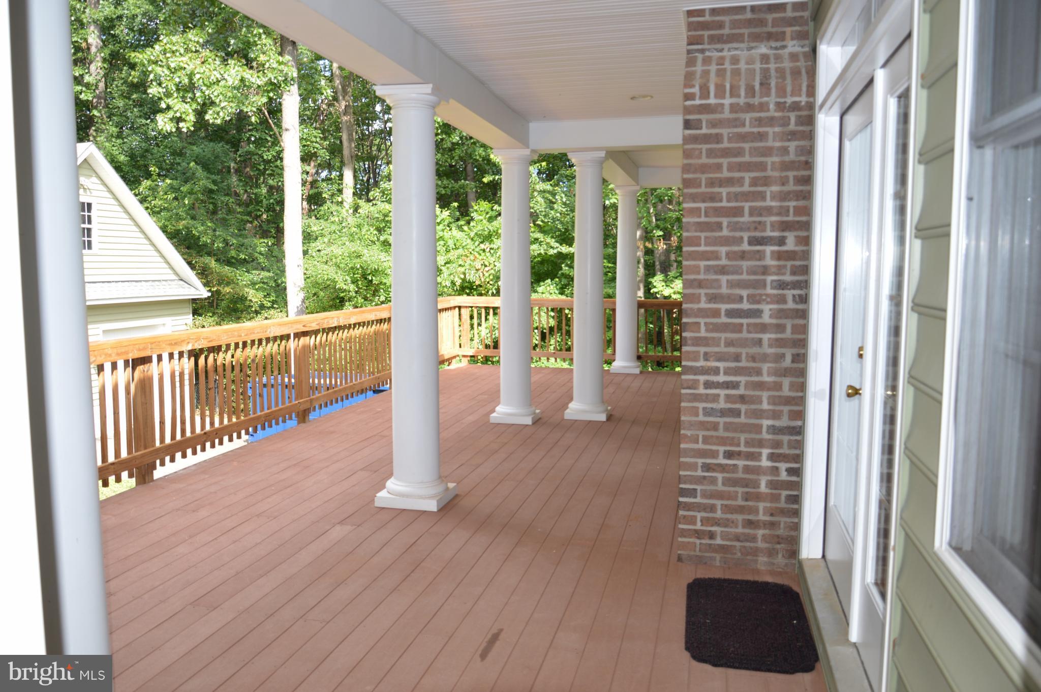 7536 Talbot Run Road Mount Airy, MD 21771 - Photo 16 of 22 a view of a balcony with wooden floor