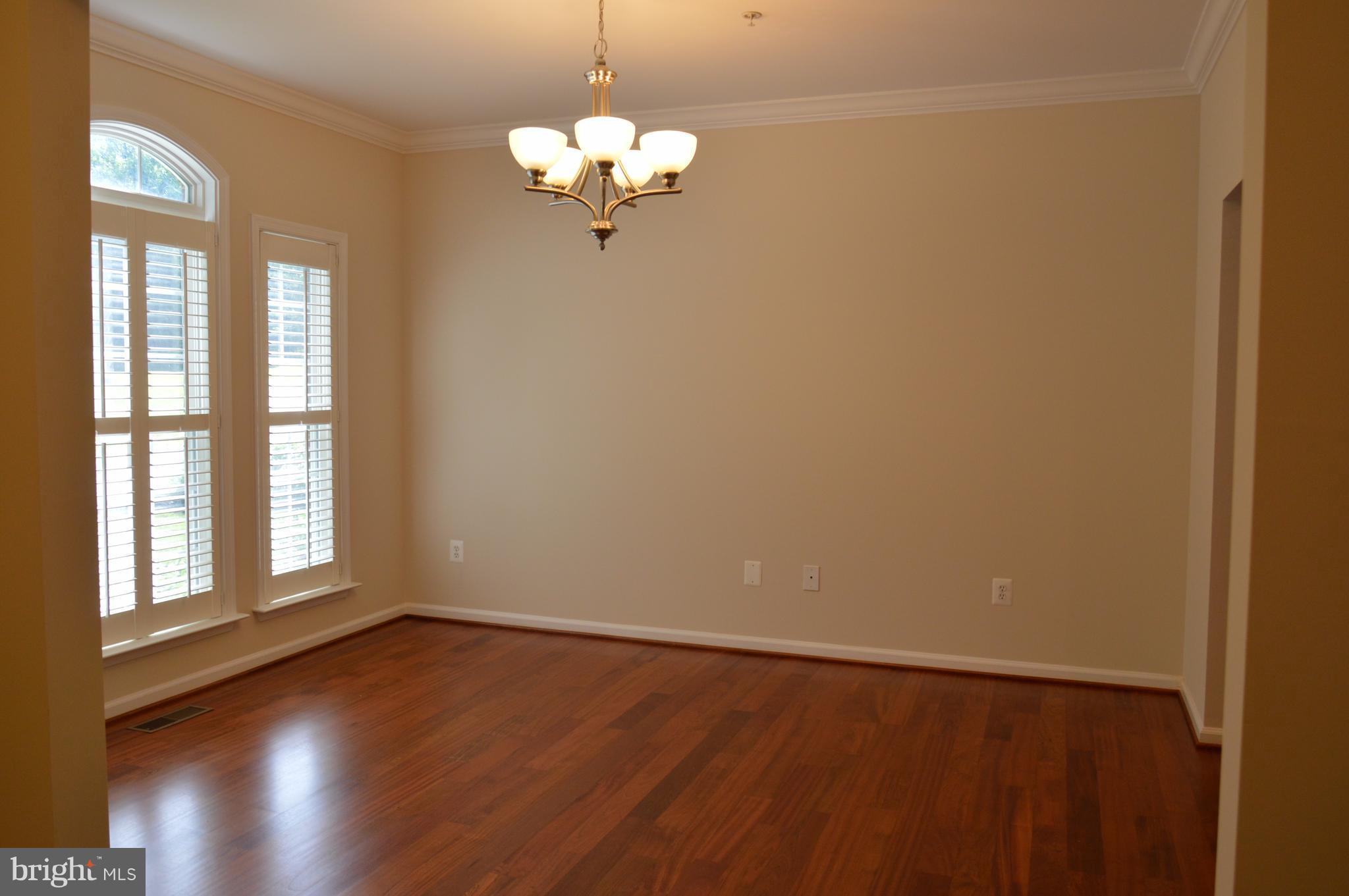 7536 Talbot Run Road Mount Airy, MD 21771 - Photo 21 of 22 wooden floor in an empty room with a window