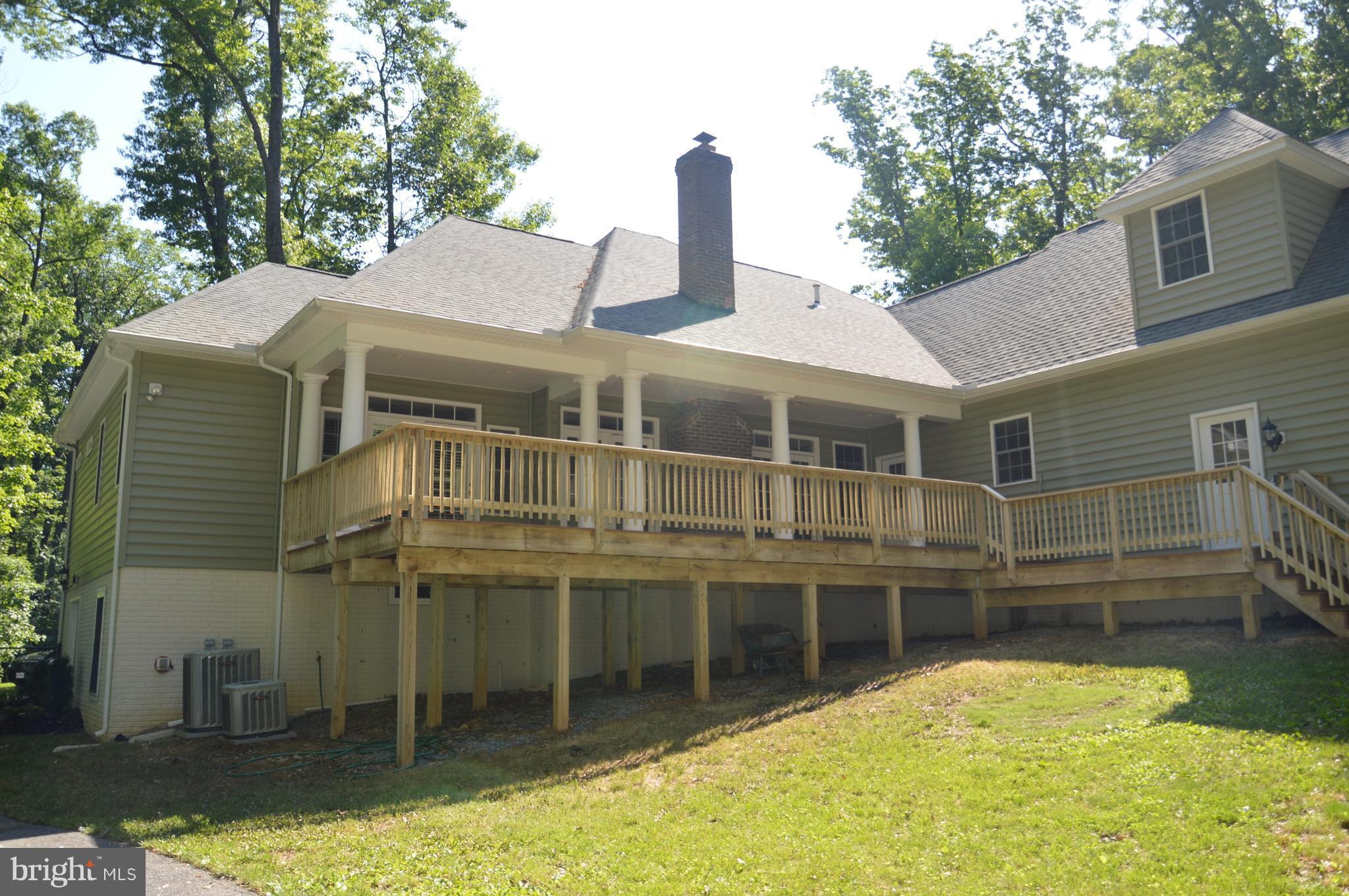 7536 Talbot Run Road Mount Airy, MD 21771 - Photo 4 of 22 a front view of a house with a swimming pool