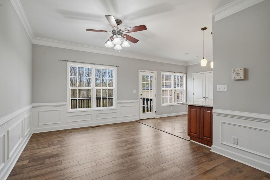 42 Nate Trail Dallas, GA 30157 - Photo 14 of 67 a view of an empty room with wooden floor and a window