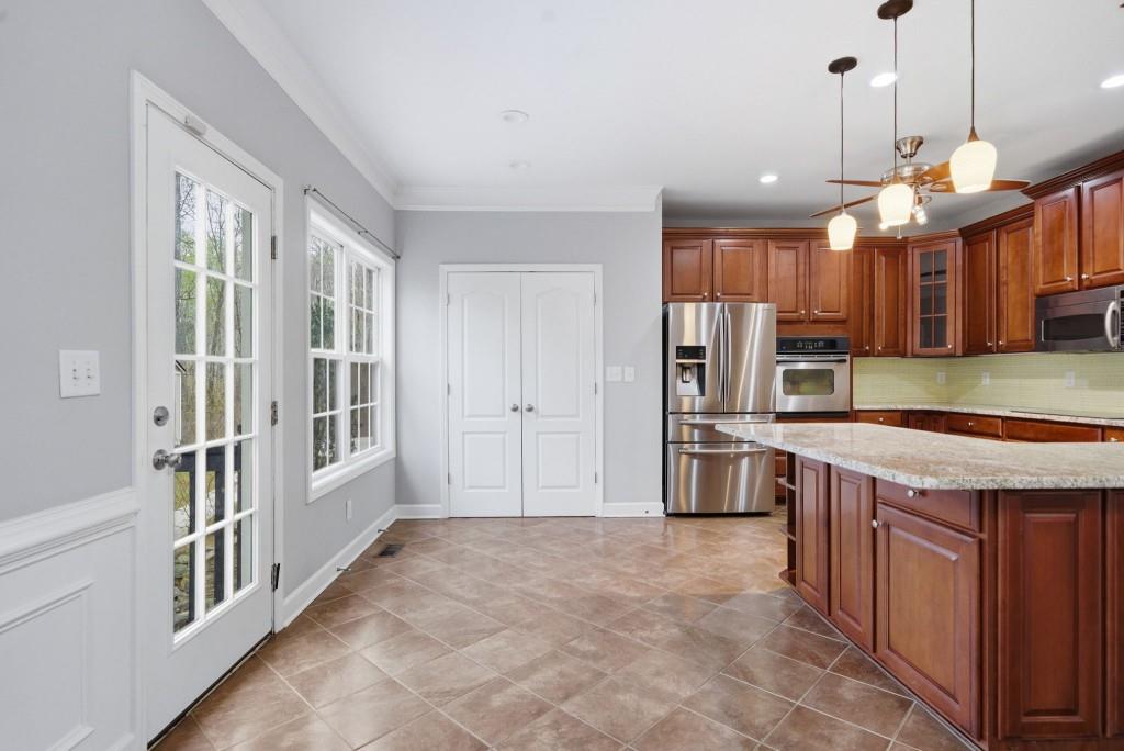 42 Nate Trail Dallas, GA 30157 - Photo 16 of 67 a kitchen with stainless steel appliances granite countertop a stove and a sink