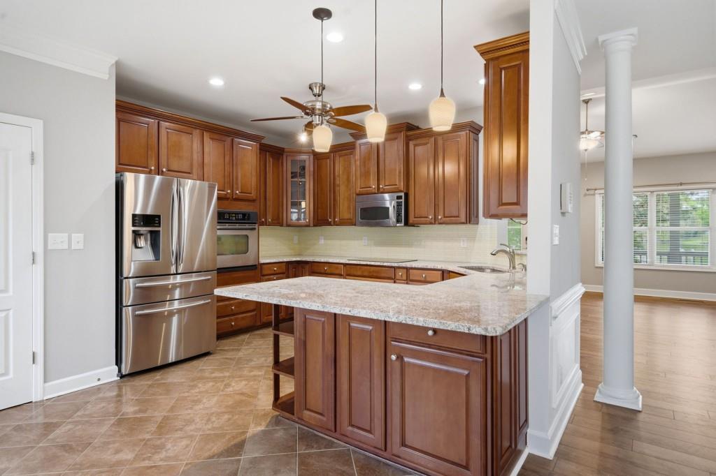 42 Nate Trail Dallas, GA 30157 - Photo 18 of 67 a kitchen with stainless steel appliances granite countertop a refrigerator a sink and a stove