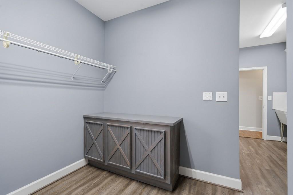 42 Nate Trail Dallas, GA 30157 - Photo 31 of 67 a view of an empty room with wooden floor and a window