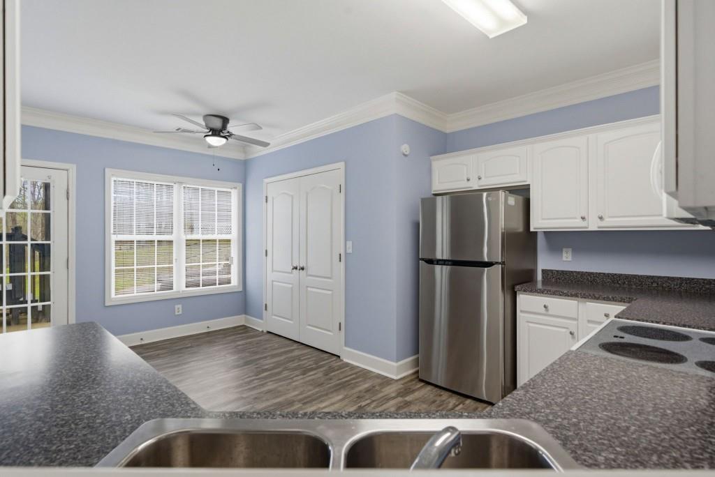 42 Nate Trail Dallas, GA 30157 - Photo 40 of 67 a kitchen with a refrigerator and a sink