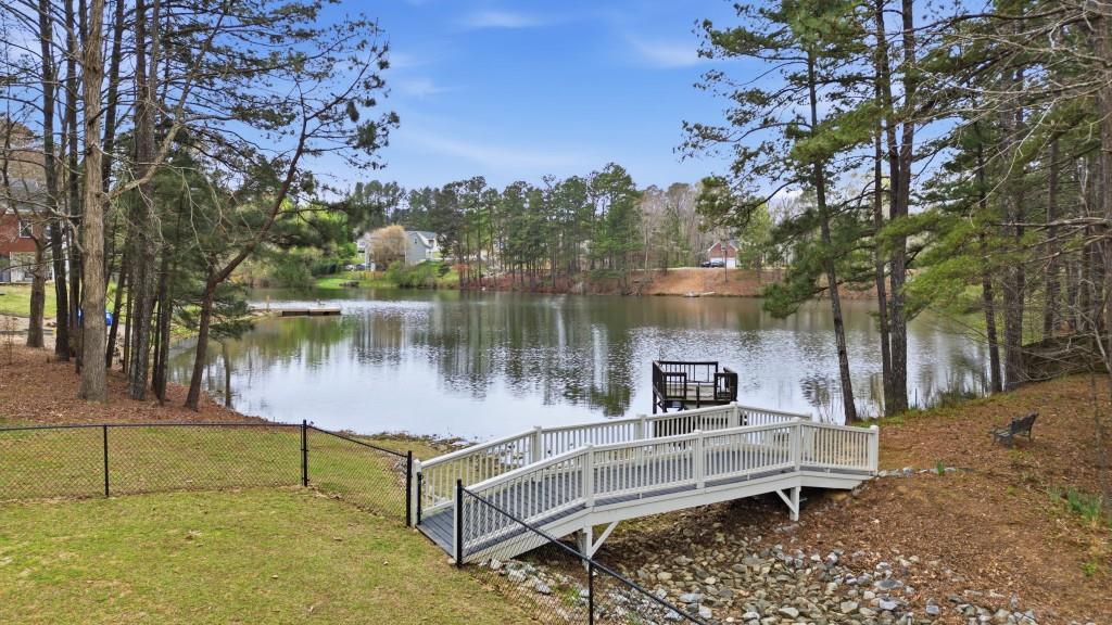 42 Nate Trail Dallas, GA 30157 - Photo 4 of 67 a lake view with a bench and lake view