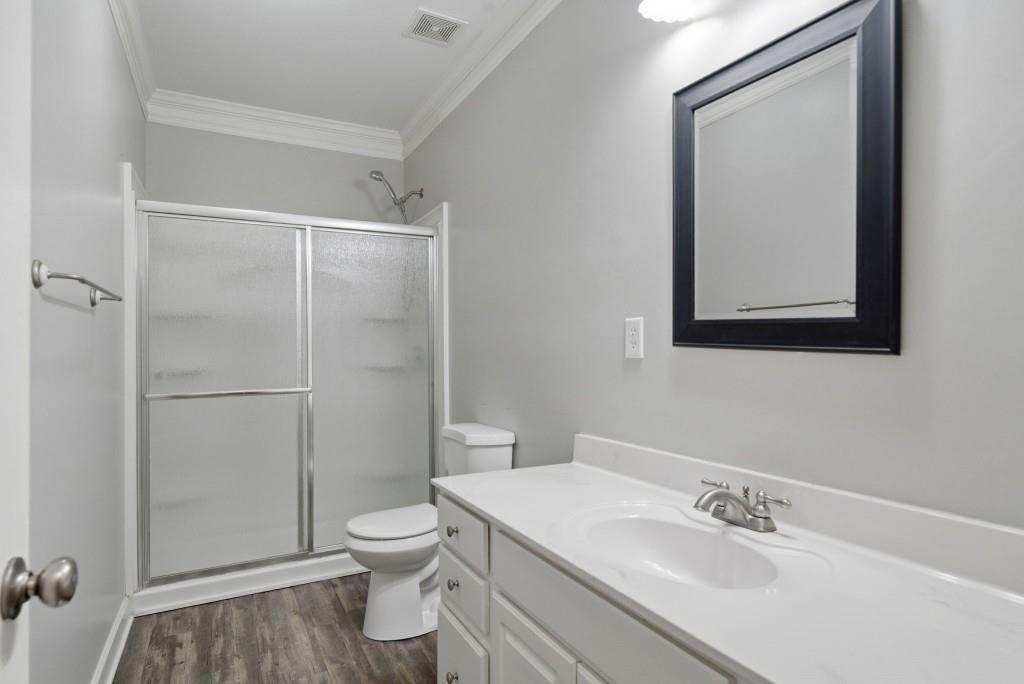 42 Nate Trail Dallas, GA 30157 - Photo 43 of 67 a bathroom with a toilet a sink and a mirror