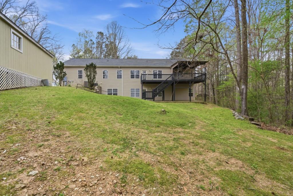 42 Nate Trail Dallas, GA 30157 - Photo 49 of 67 a view of a house with a garden