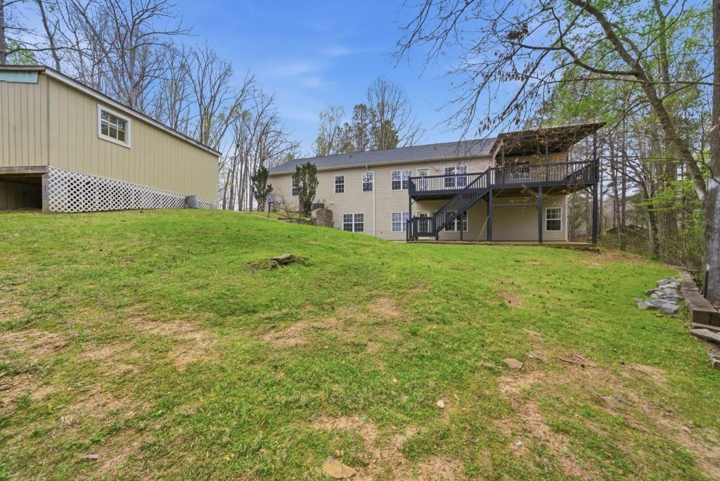 42 Nate Trail Dallas, GA 30157 - Photo 50 of 67 a view of a house with a garden