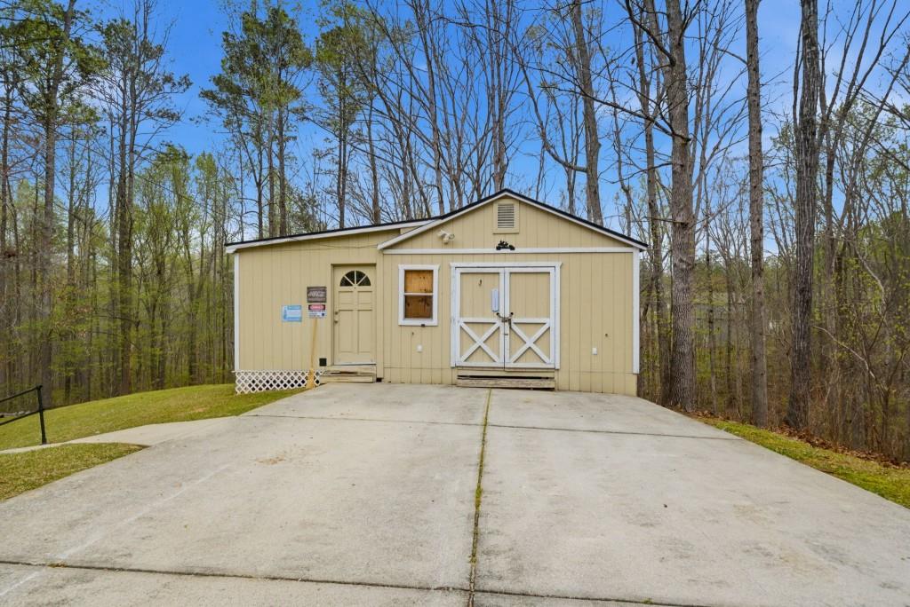 42 Nate Trail Dallas, GA 30157 - Photo 53 of 67 a front view of a house with a yard and garage