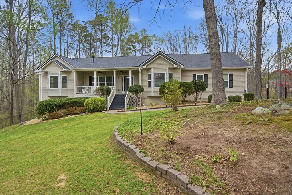 42 Nate Trail Dallas, GA 30157 - Photo 57 of 67 a front view of a house with garden