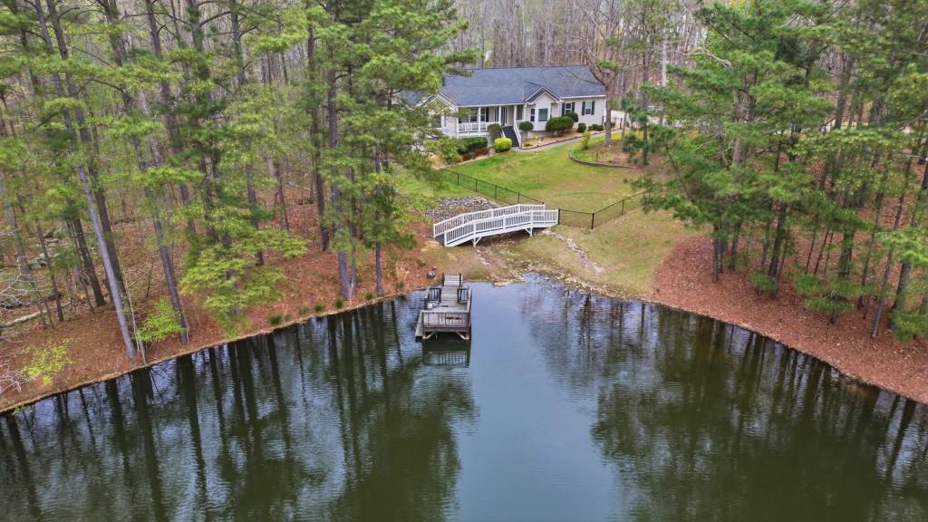 42 Nate Trail Dallas, GA 30157 - Photo 63 of 67 a view of a lake with a garden