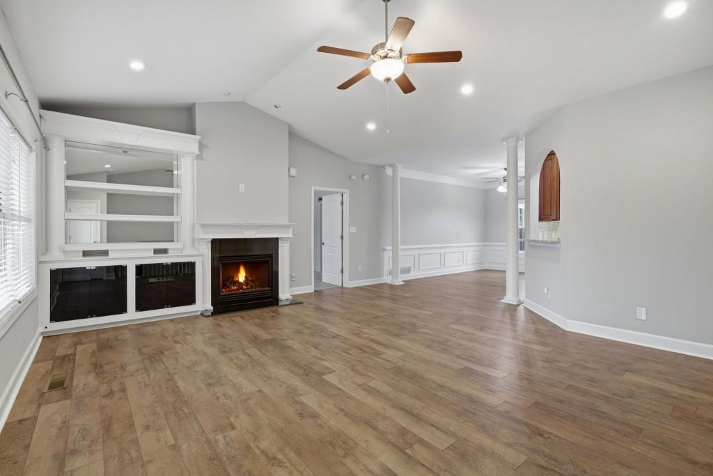 42 Nate Trail Dallas, GA 30157 - Photo 9 of 67 an empty room with windows and fireplace