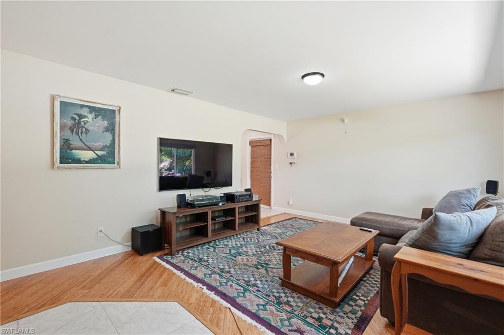 1316 Rordon Avenue Naples, FL 34103 - Photo 8 of 38 Light-toned walls complement wood-finish flooring