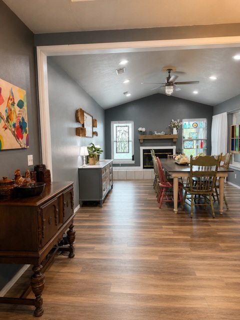221 Winding Way Road Marble Falls, TX 78654 - Photo 6 of 19 An inviting open-concept dining space features vaulted ceilings and a fireplace! Room for a big 10-12 seated table!