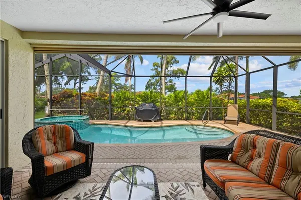 a room with furniture and a large window