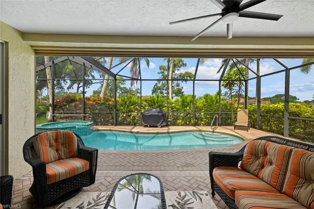 a room with furniture and a large window