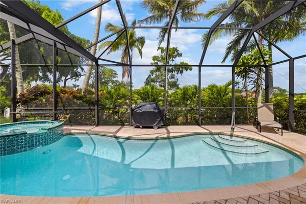 a view of a swimming pool with a patio