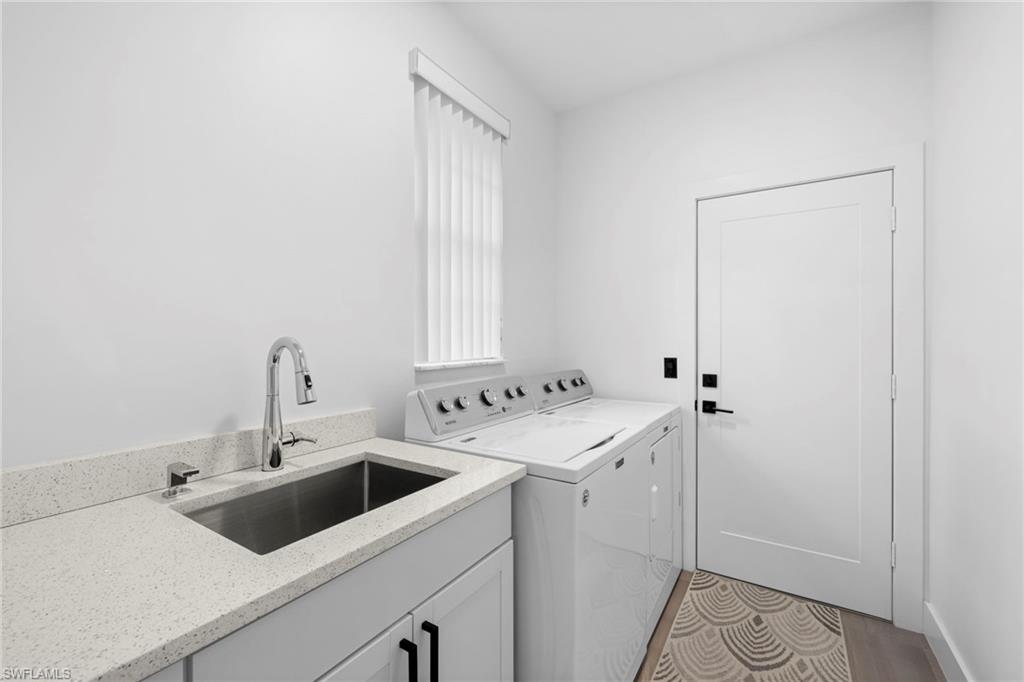 6903 Mauna Loa Lane Naples, FL 34113 - Photo 37 of 46 a utility room with dryer and washer