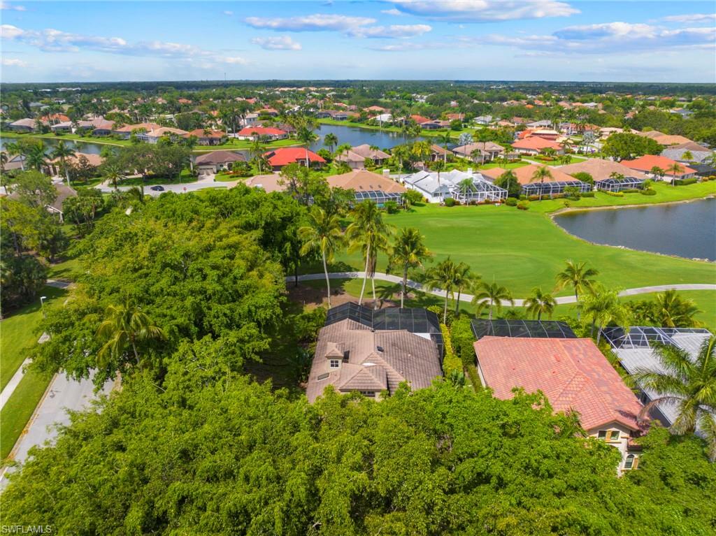 6903 Mauna Loa Lane Naples, FL 34113 - Photo 38 of 46 an aerial view of residential houses with outdoor space