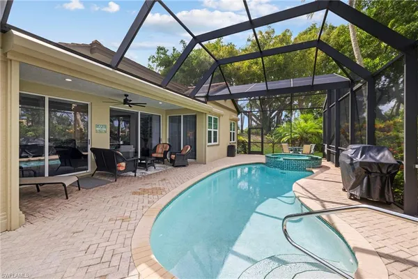 a view of a swimming pool with a patio