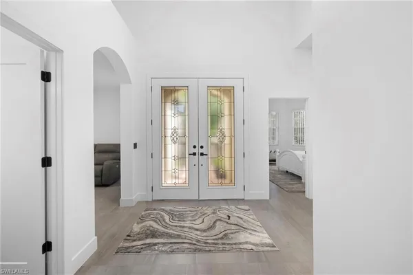 a view of a room that has a bed in it