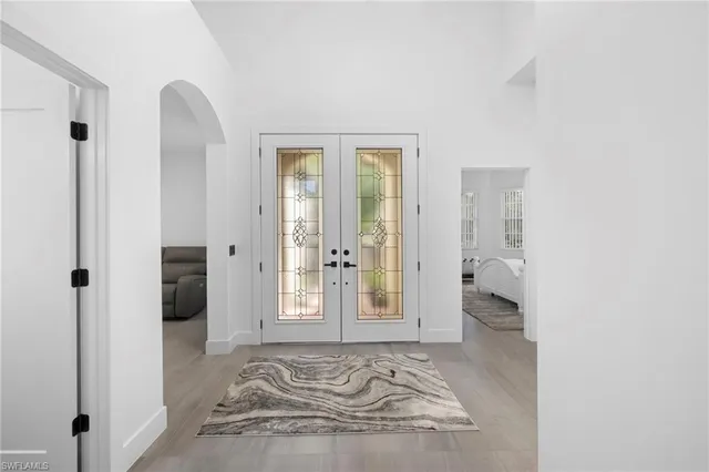 a view of a room that has a bed in it