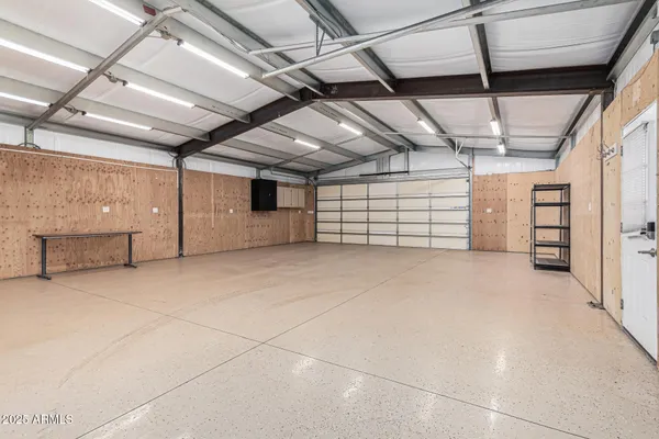a view of empty room with wooden ceiling