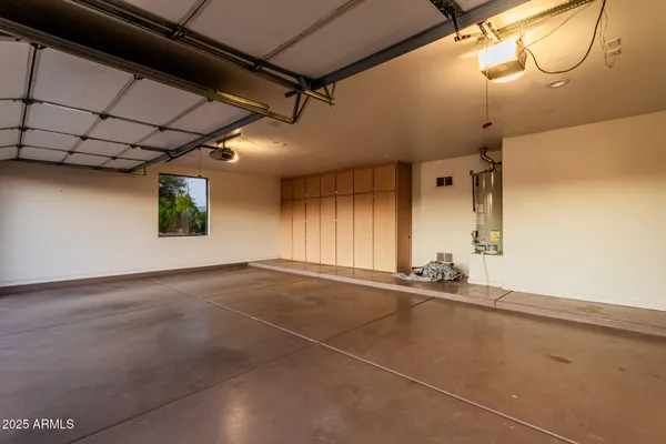 a view of swimming pool with a lounge chair