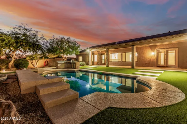 a view of a living room with a sink and dishwasher