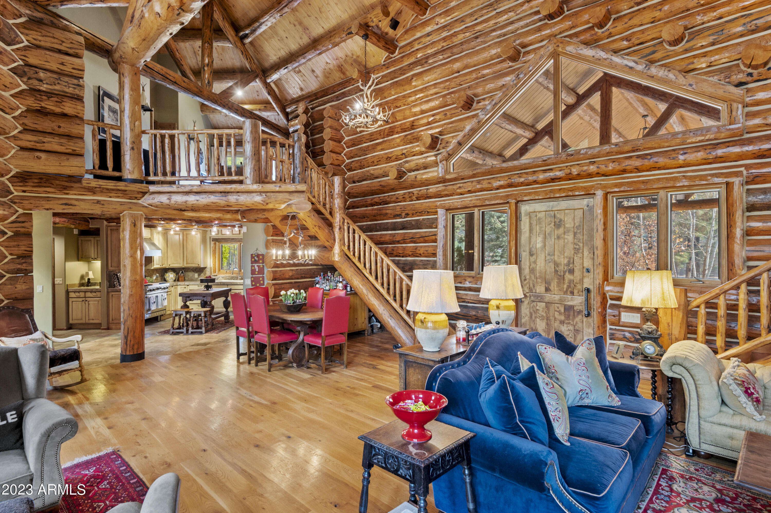 3905 Doc Raymond Flagstaff, AZ 86005 - Photo 14 of 43 a living room with furniture a air conditioner vent and a chandelier