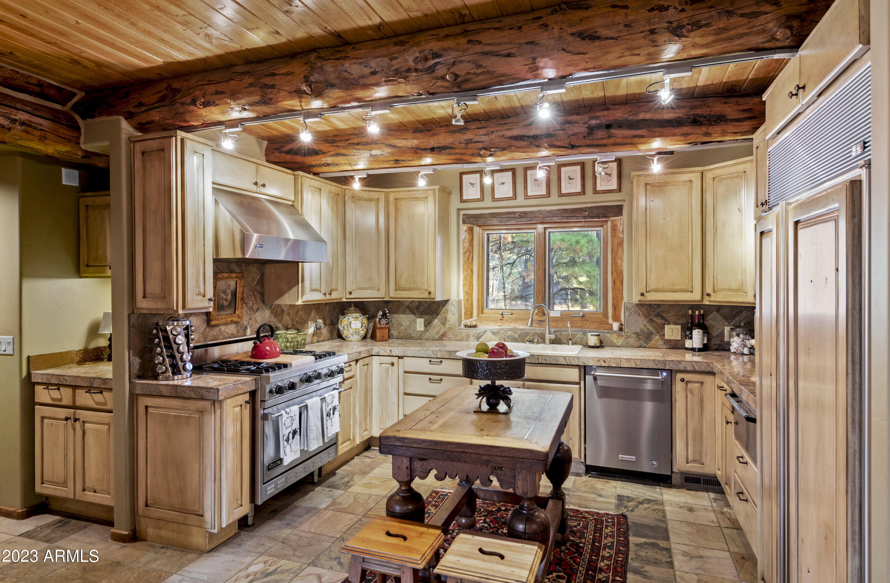 3905 Doc Raymond Flagstaff, AZ 86005 - Photo 15 of 43 a kitchen with sink cabinets and window
