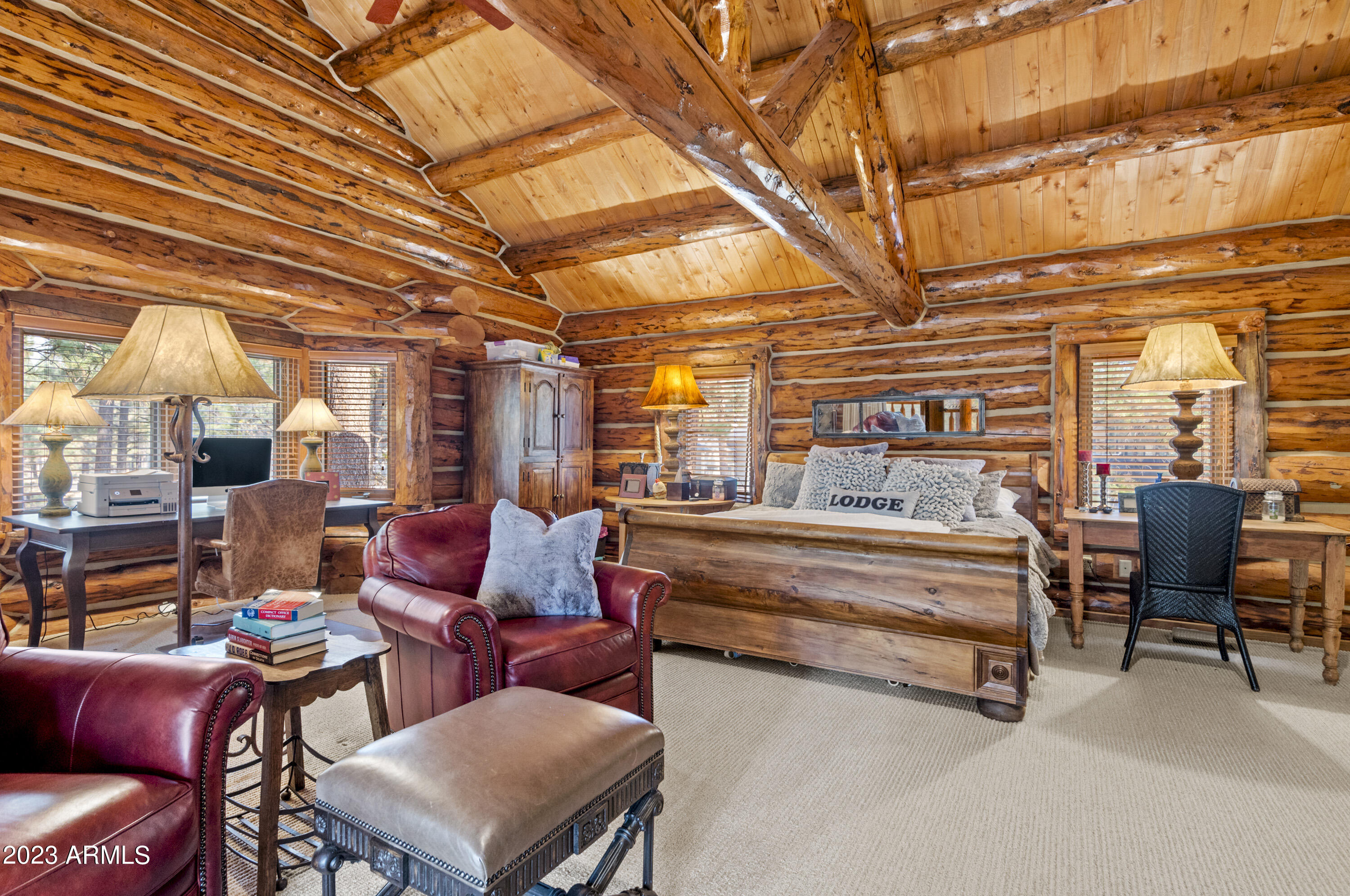 3905 Doc Raymond Flagstaff, AZ 86005 - Photo 22 of 43 a living room with furniture and a chandelier