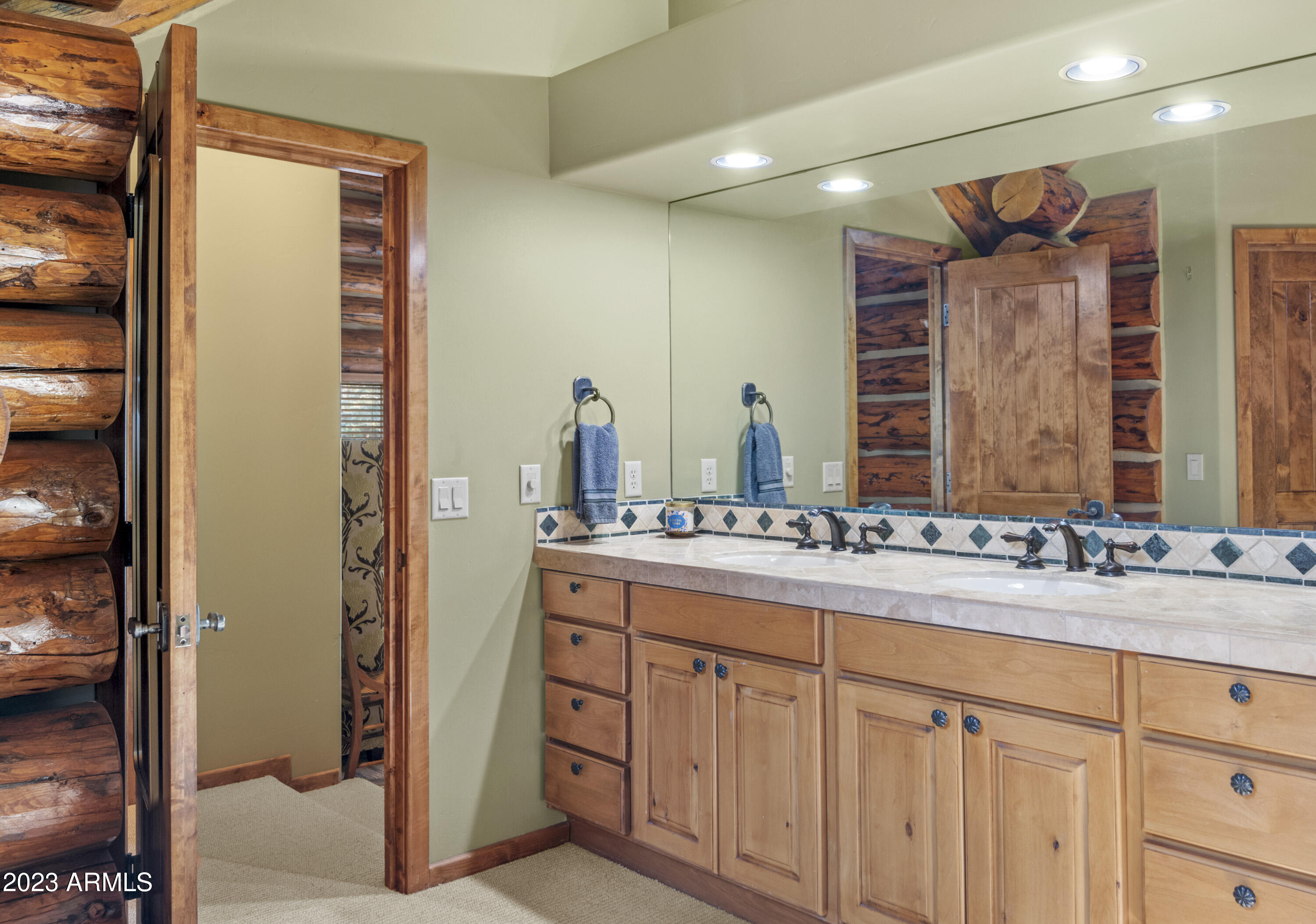 3905 Doc Raymond Flagstaff, AZ 86005 - Photo 28 of 43 a bathroom with a double vanity sink and a mirror