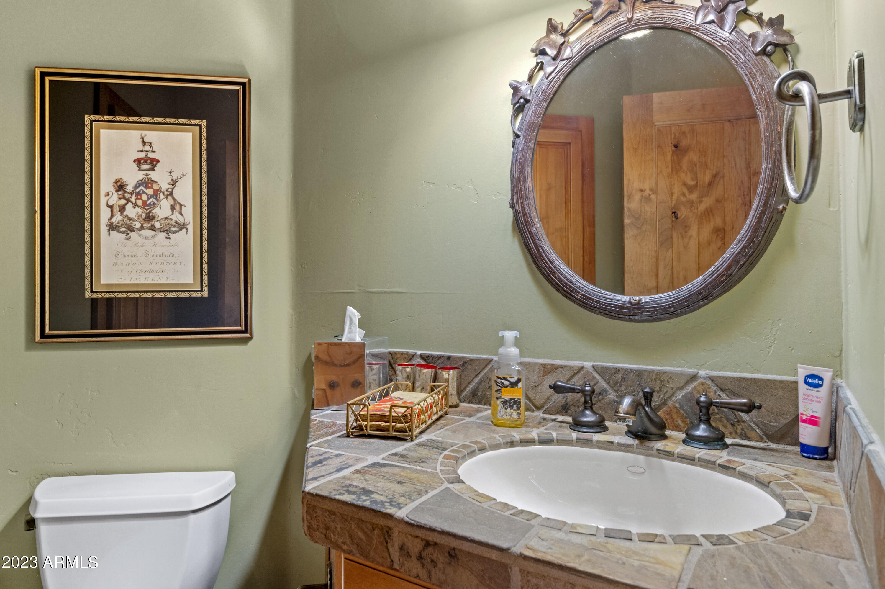 3905 Doc Raymond Flagstaff, AZ 86005 - Photo 35 of 43 a bathroom with a toilet sink and mirror