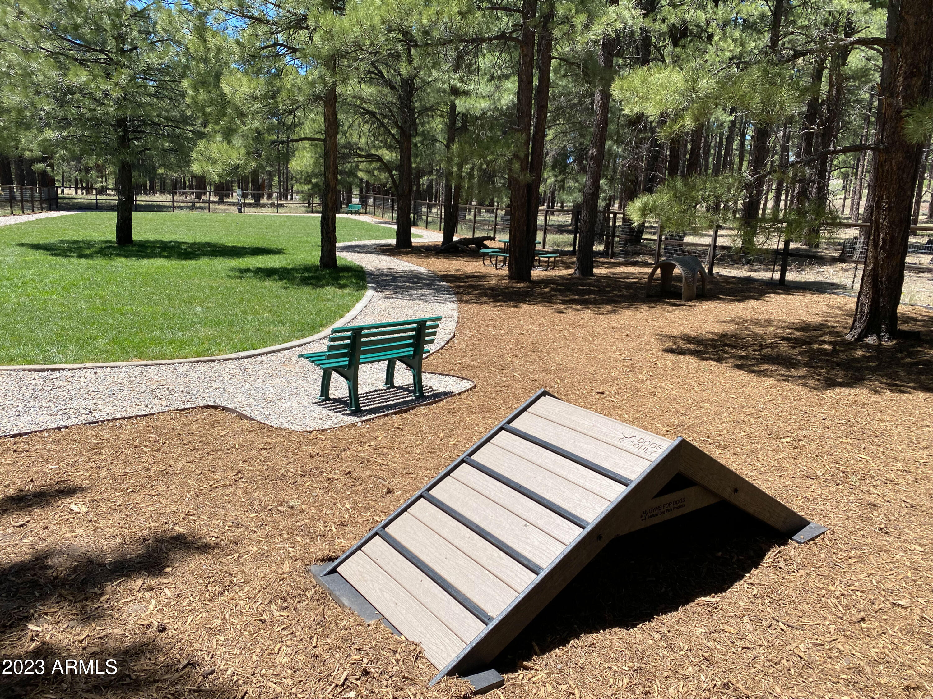 3905 Doc Raymond Flagstaff, AZ 86005 - Photo 39 of 43 a park bench sitting in the middle of a park