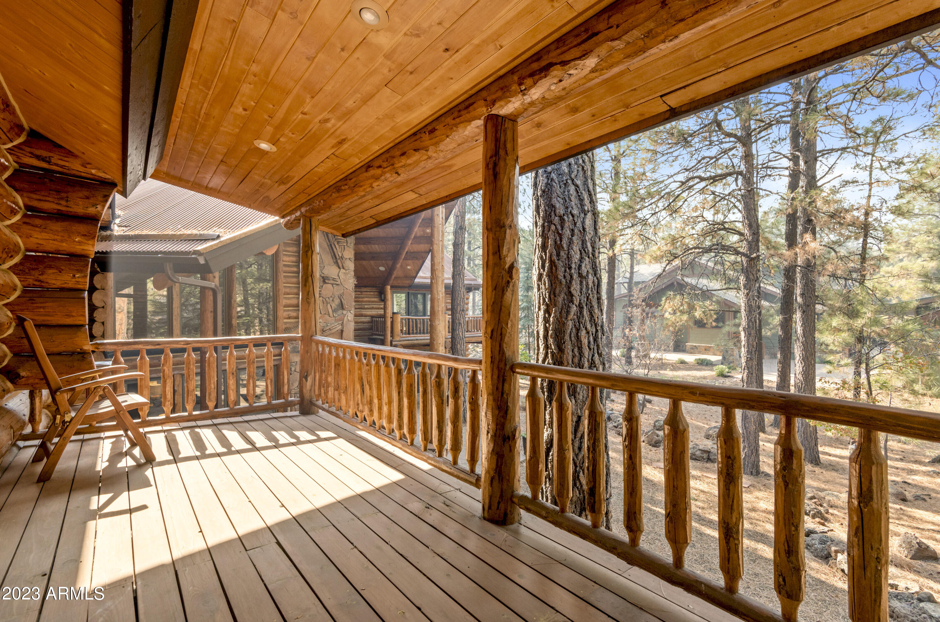 3905 Doc Raymond Flagstaff, AZ 86005 - Photo 7 of 43 a view of a wooden house with large windows