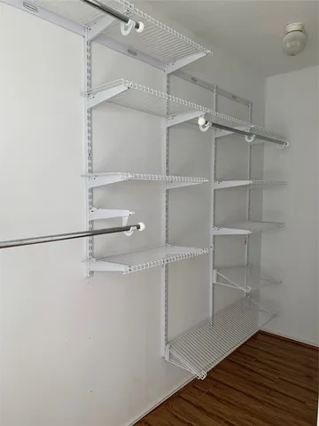 a view of a room with racks on the wall