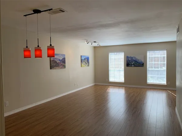 a view interior of a house with wooden floor and windows